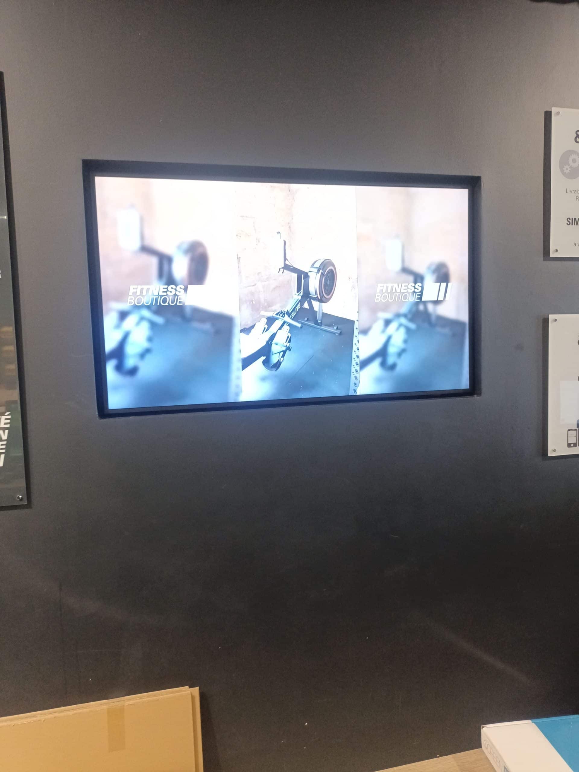 Installation écran 55" Fitness Boutique Olivet